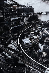 grayscale aerial photography of buildings and roads thumbnail