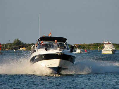 two men riding speedboat during daytime thumbnail