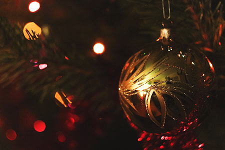 Closeup shot of gold ball decoration on a Christmas tree thumbnail