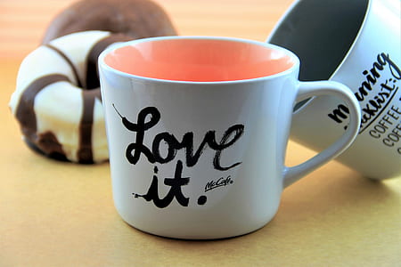 white ceramic mug beside doughnut thumbnail