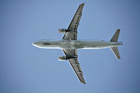 white airliner under blue sky at daytime thumbnail