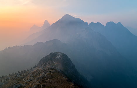 aerial photography of mountain under blue sky thumbnail