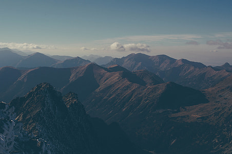silhouette image of mountain hill under white clouds thumbnail