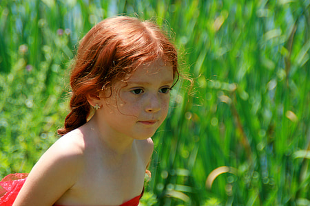 selective focus photography of girl in red strapless dress thumbnail