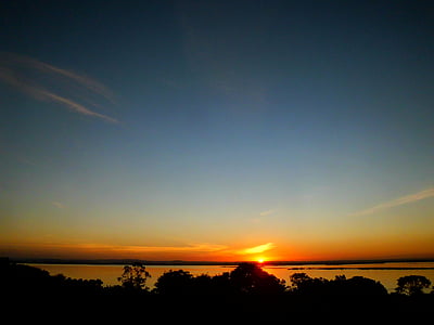 landscape photography of body of water under golden hour thumbnail