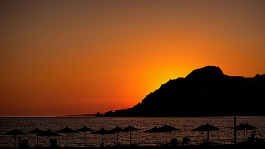 silhouette of mountain during sunset thumbnail