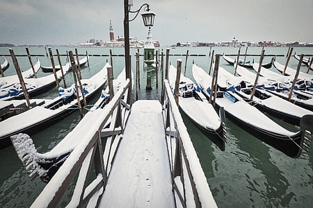 brown wooden dock between boats thumbnail