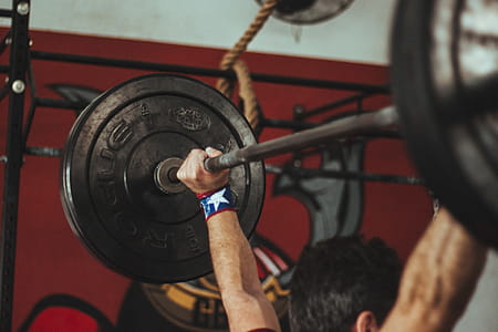 Person Carrying Black Barbell thumbnail