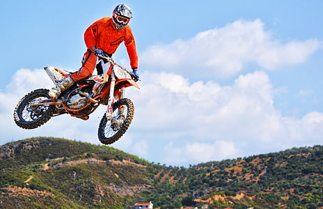 man riding motocross dirt bike thumbnail
