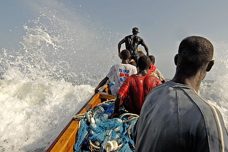 five men riding canoe on body of water thumbnail