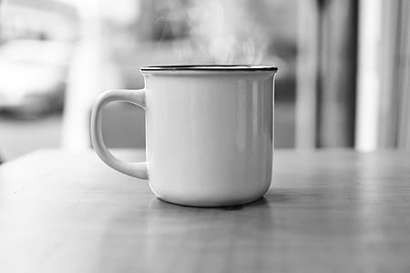 white enamel cup smoking on table thumbnail