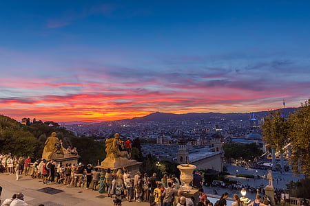 group of people standing near statues during sunset thumbnail