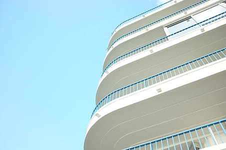 white concrete 4-storey building thumbnail