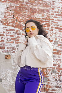 woman standing wearing jacket and pants thumbnail