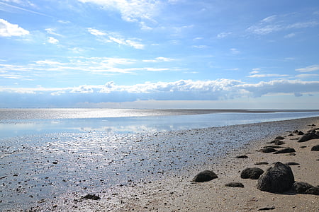 black rock formations near the sea during daytime thumbnail