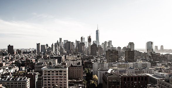 aerial photo of city under white clouds at daytime thumbnail