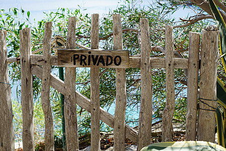 brown wooden fence near body of water thumbnail
