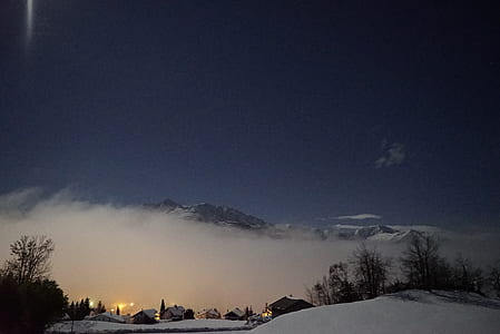 village in snowy plaid covered by fog thumbnail