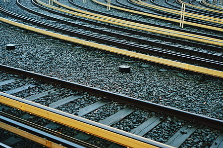 gray and yellow metal train rails thumbnail