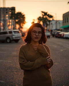 golden hour photography of woman in brown sweater thumbnail