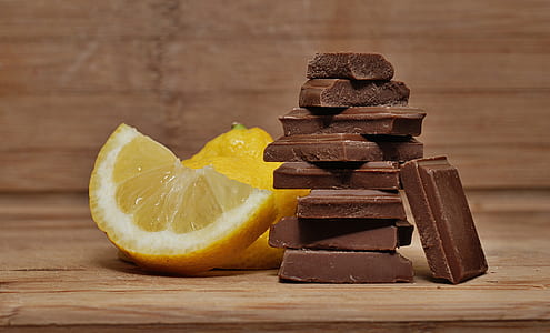 shallow focus photography of chocolate bar with sliced lemon thumbnail