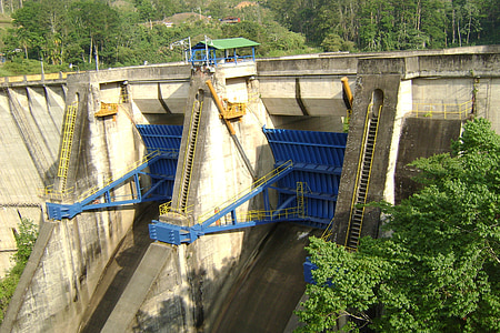 brown concrete dam near tree thumbnail