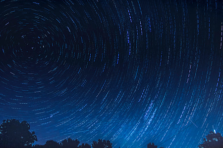 Stars trail in the night sky thumbnail