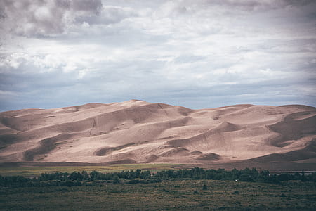photo of steppe with mountain background thumbnail