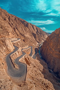 aerial view of asphalt road on body of mountain thumbnail
