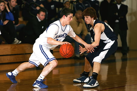 two men playing basketball inside court thumbnail