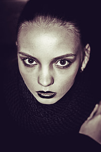 Woman in black Lip tint with black turtle neck dress thumbnail
