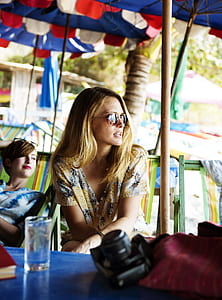 woman sitting on green chair thumbnail