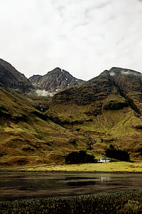 body of water near mountain thumbnail