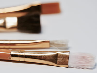 selective focus photo of paintbrushes above white surface thumbnail