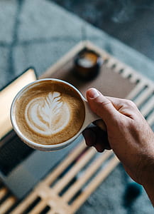 person holding coffee thumbnail