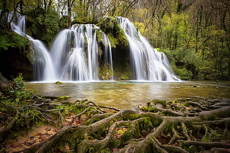 time lapse photo of waterfalls surrounded by trees thumbnail