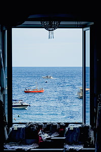 four boats travelling on sea thumbnail