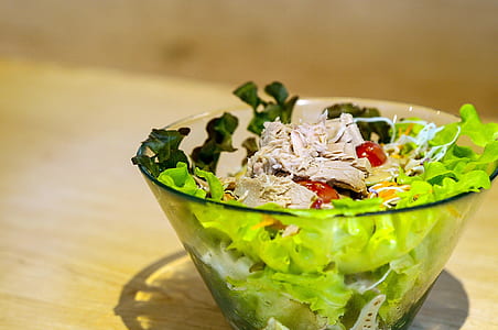 salad on clear glass bowl shallow focus photography thumbnail