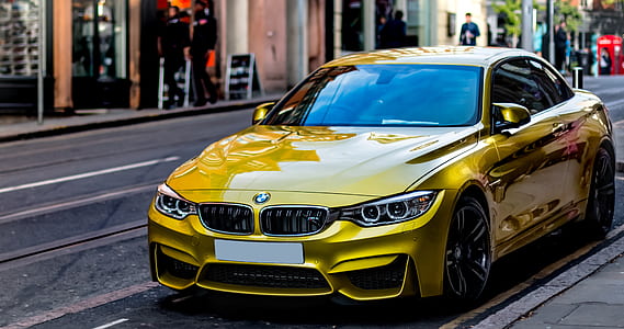 yellow BMW coupe thumbnail