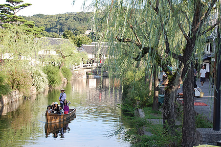 group of person riding on brown row boat thumbnail