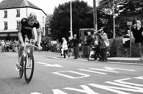 grayscale photography of man riding bicycle thumbnail