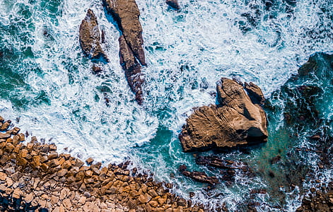aerial photography of islet and sea thumbnail