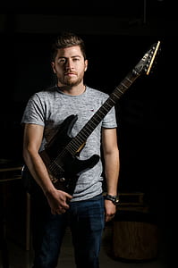 man holding electric guitar thumbnail