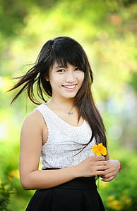 selective focus of woman white and black dress portrait thumbnail