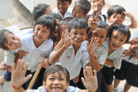 boys and girls in white school uniforms thumbnail