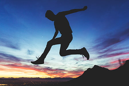 silhouette of jumping man near mountain thumbnail