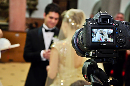 selective focus photography of camera displaying wedded couple thumbnail