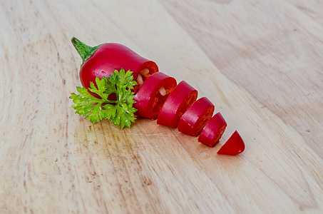 sliced chilli on brown surface thumbnail