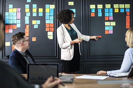 woman sticking notes on wall thumbnail
