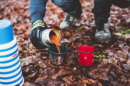 person pouring soup on tumbler lid thumbnail